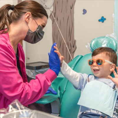 A woman and a child wearing gloves and gloves, representing bi-specialty practice