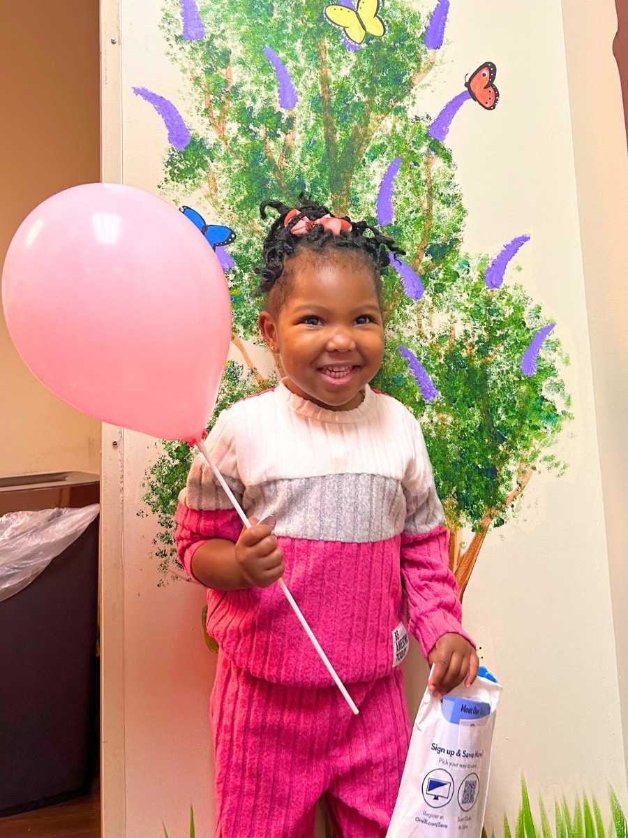 Girl holding balloon