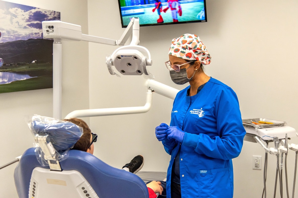 Dental hygienist and patient