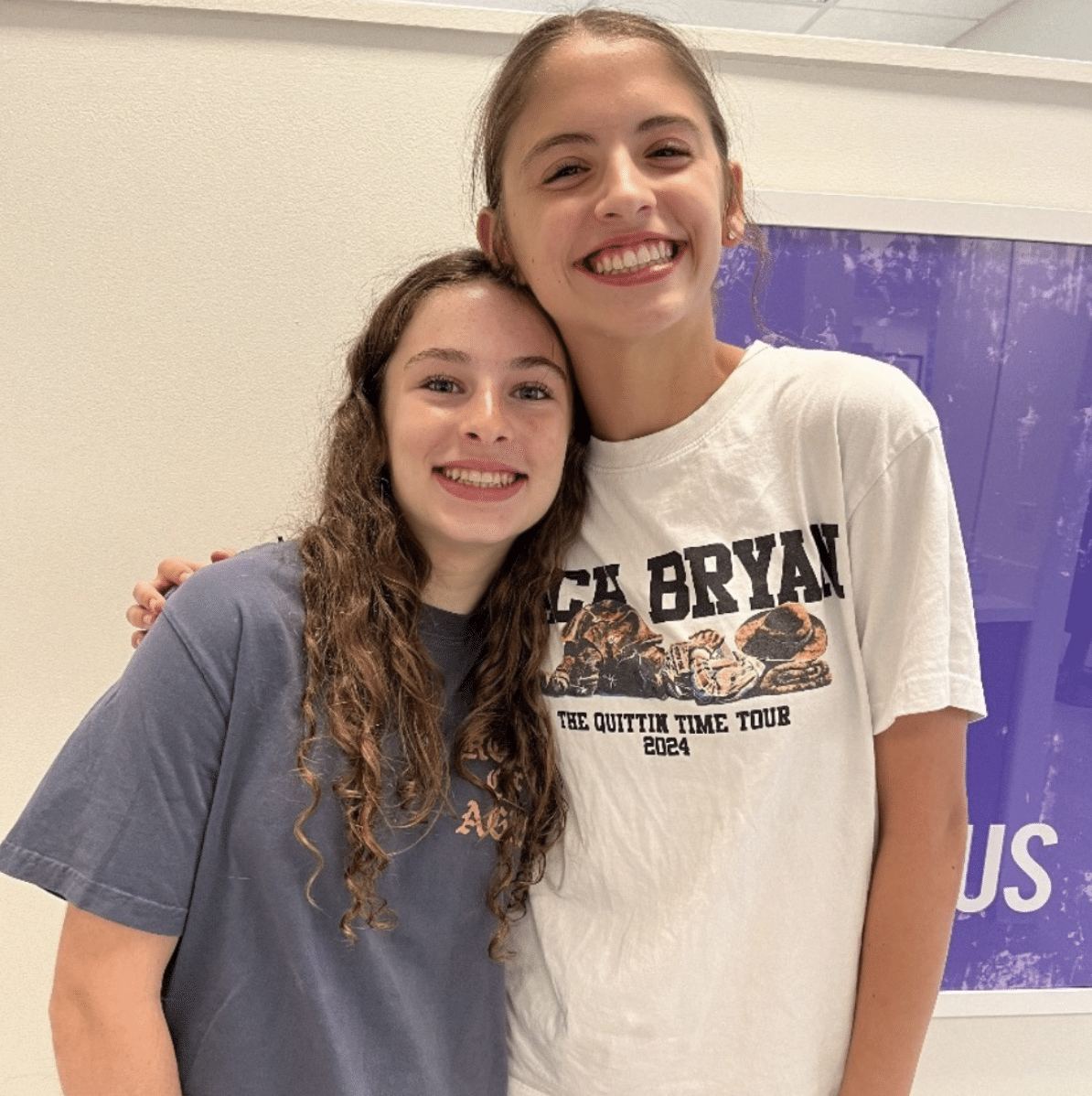 Teens smiling and hugging