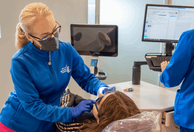 Child receiving orthodontic treatment by dr. Ritter, representing best age for first orthodontic check-up